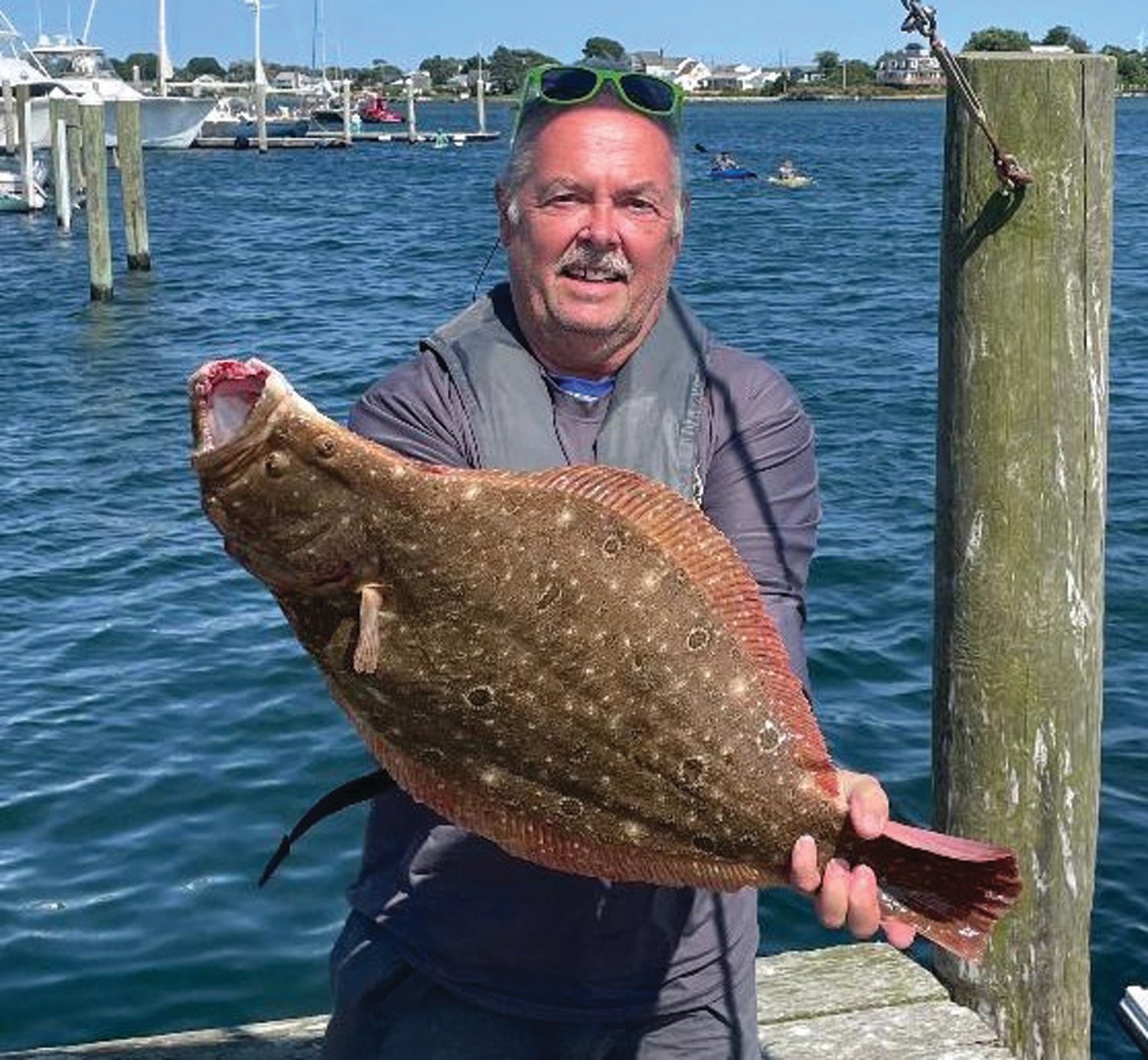 FLUKEZILLA: Tom Torrico of Massachusetts with the 14-pound, 29-inch fluke (summer flounder) he caught fishing off Block Island last week.